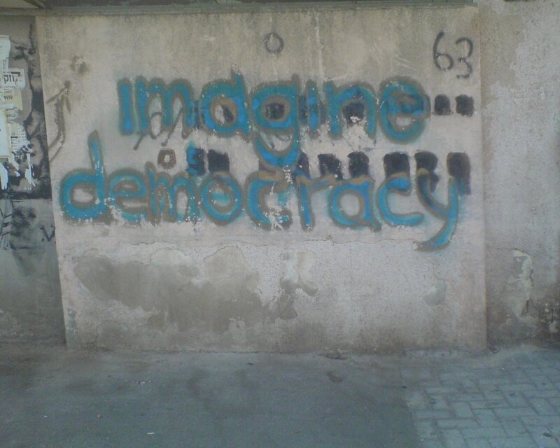 Graffiti reading 'Imagine democracy'