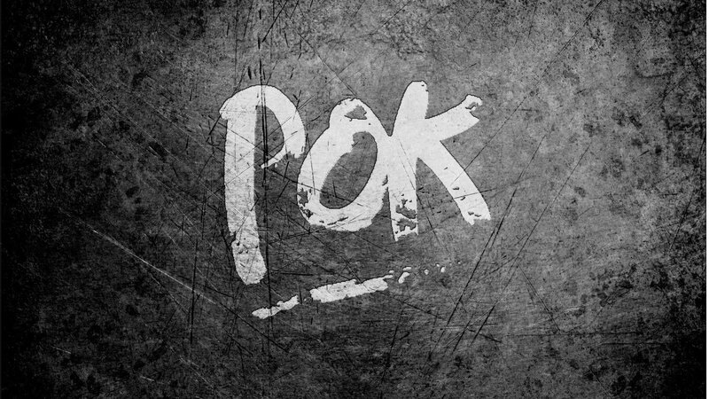 graffiti-style text on textured surface