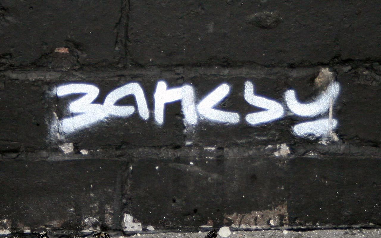 graffiti tag on brick wall