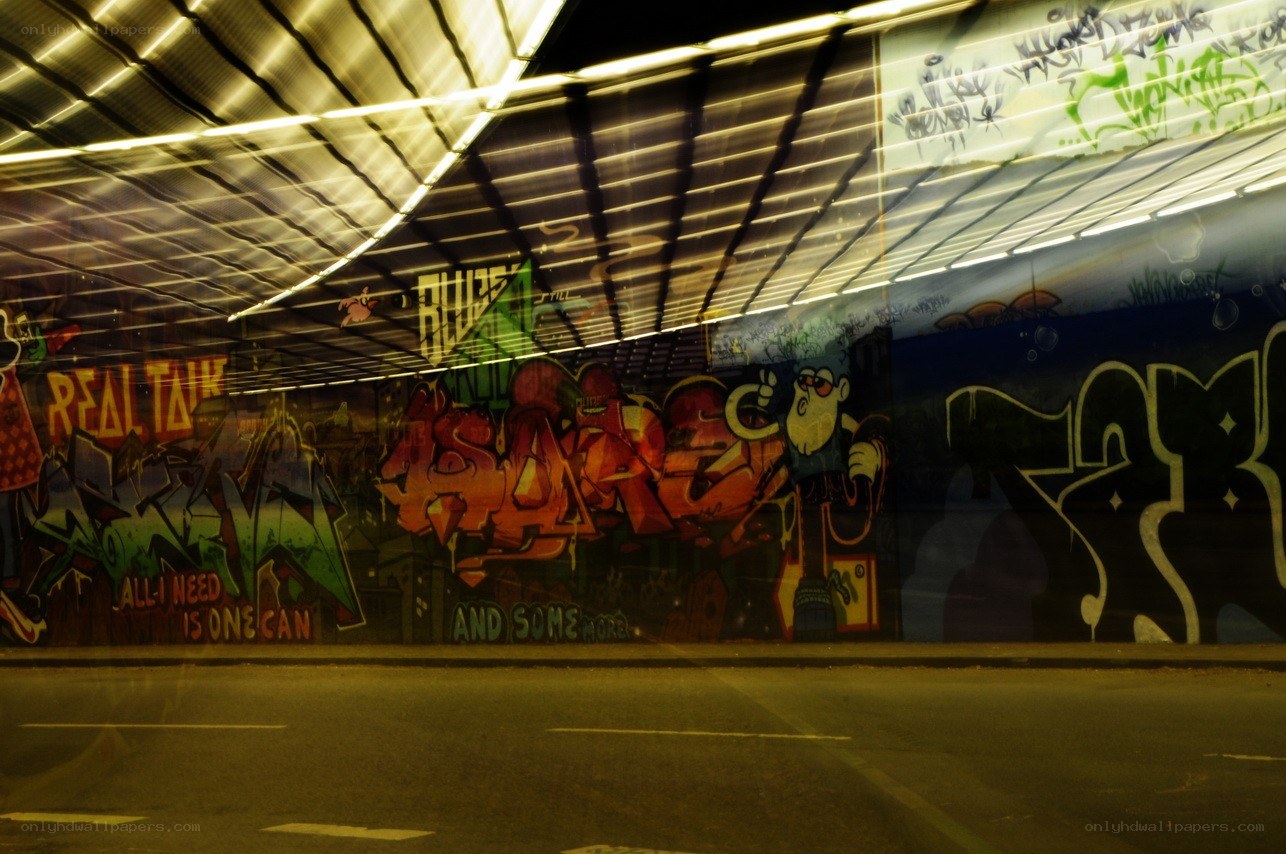 graffiti under a bridge at night