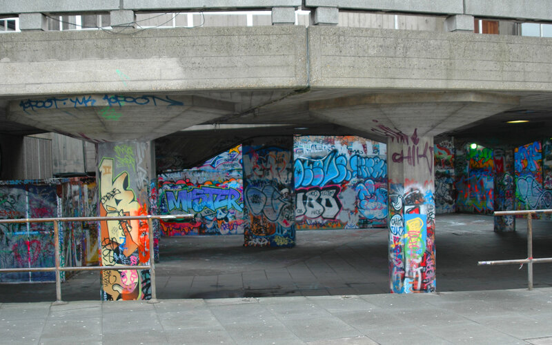 graffiti under concrete bridge