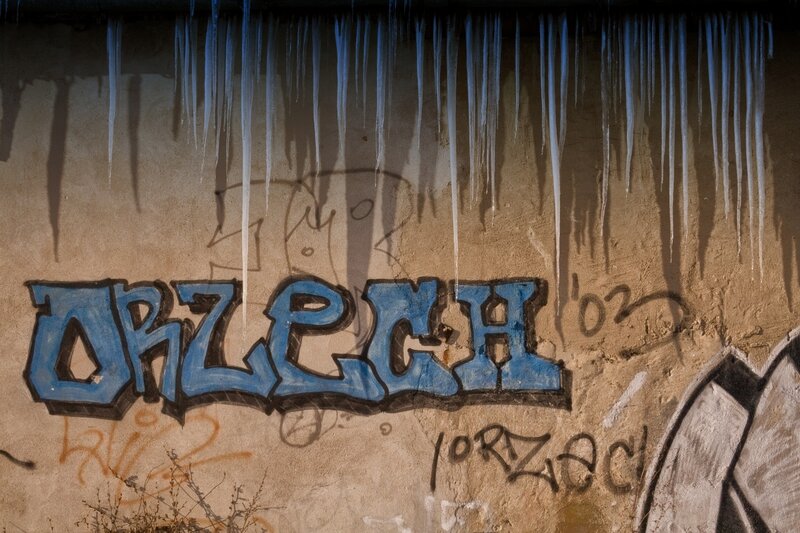 Graffiti with icicles on wall