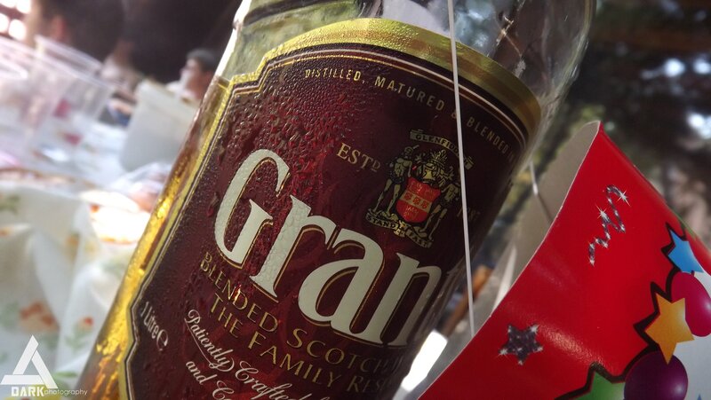 Gran whisky bottle at party
