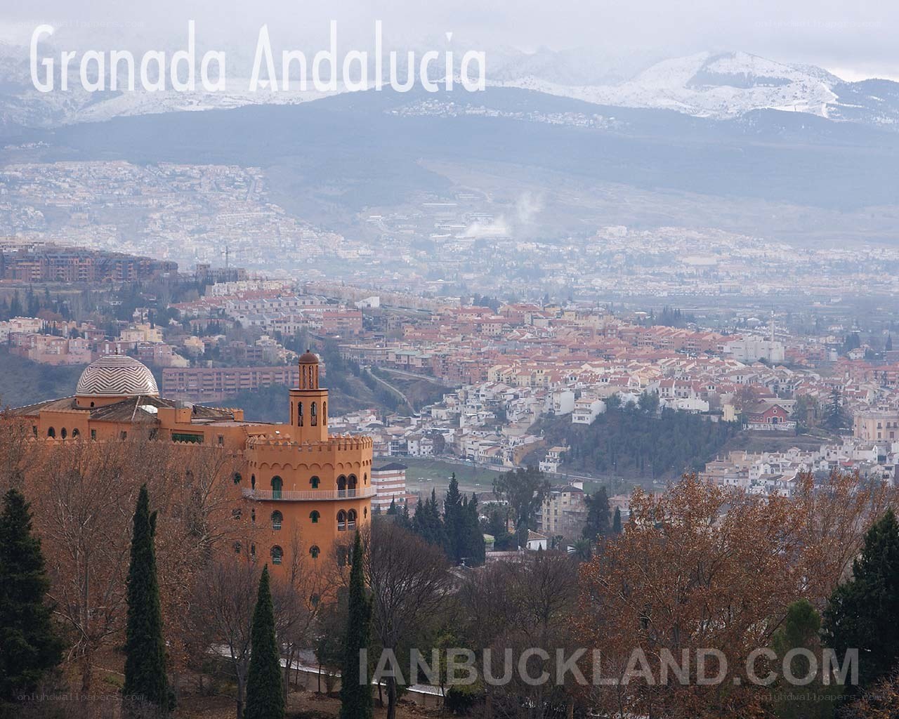 Granada cityscape with snow-capped mountains