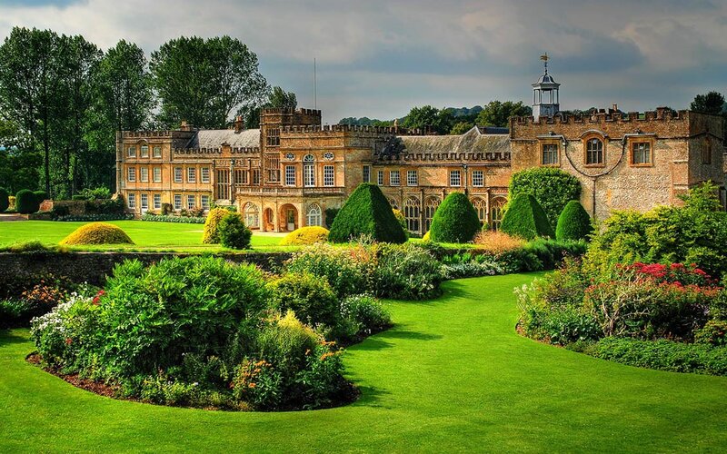 grand estate with manicured gardens