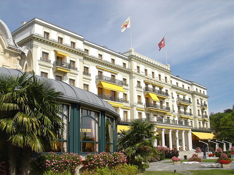 Grand hotel with flags and flowers