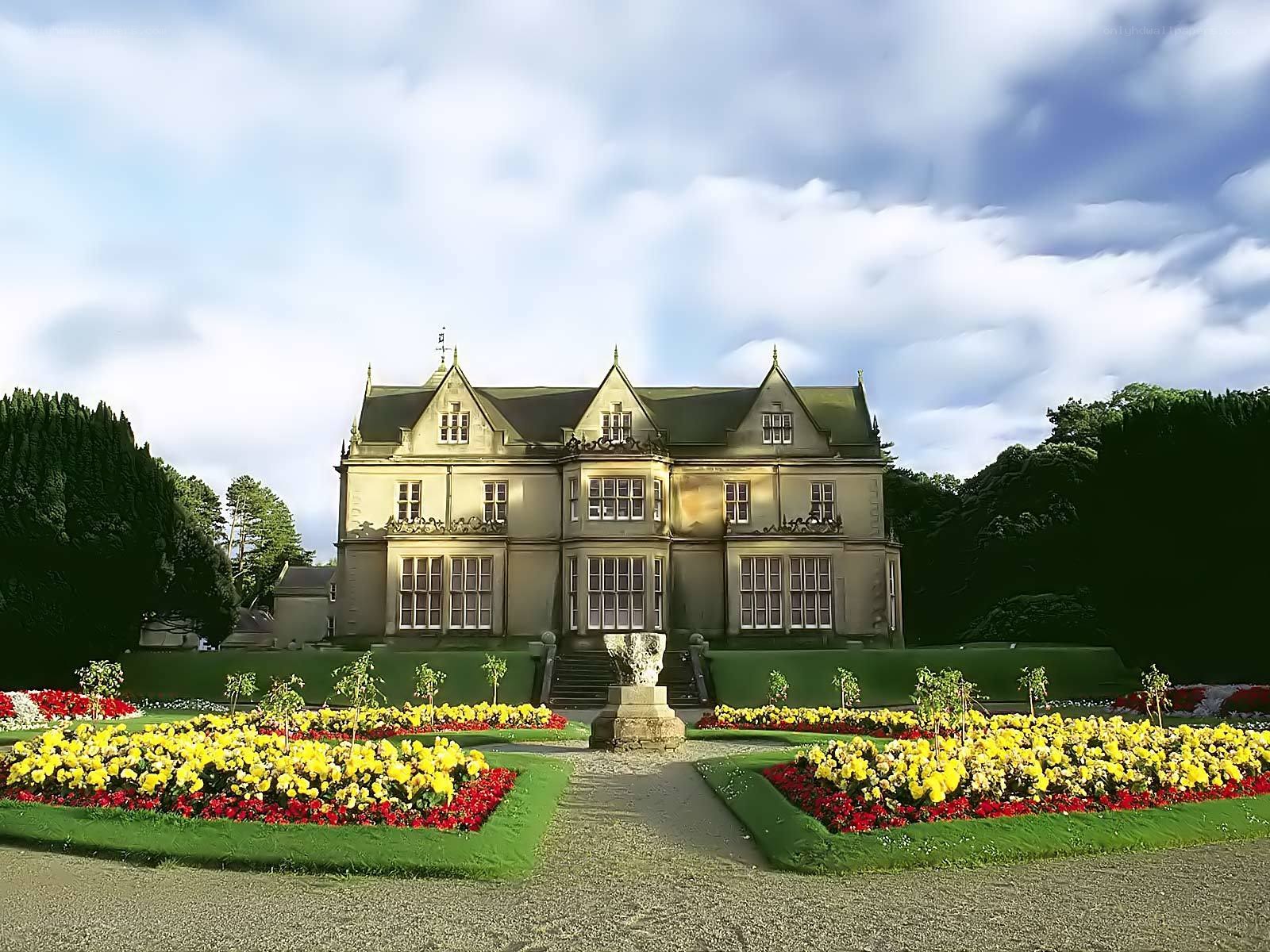 grand manor with flower gardens
