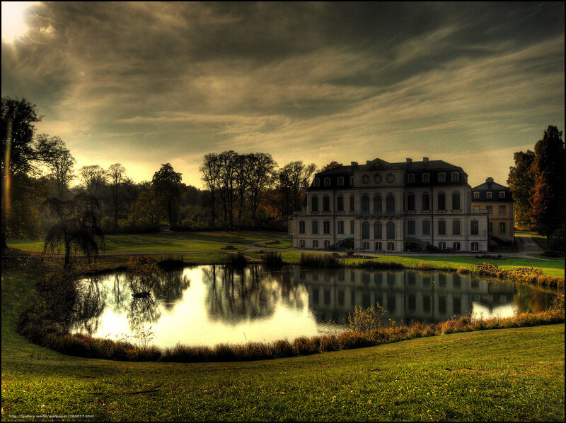 Grand mansion by a pond