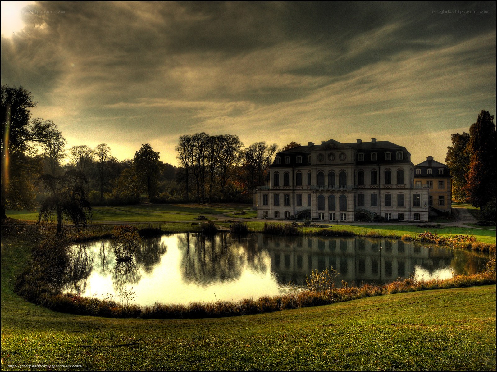 Grand mansion by a pond