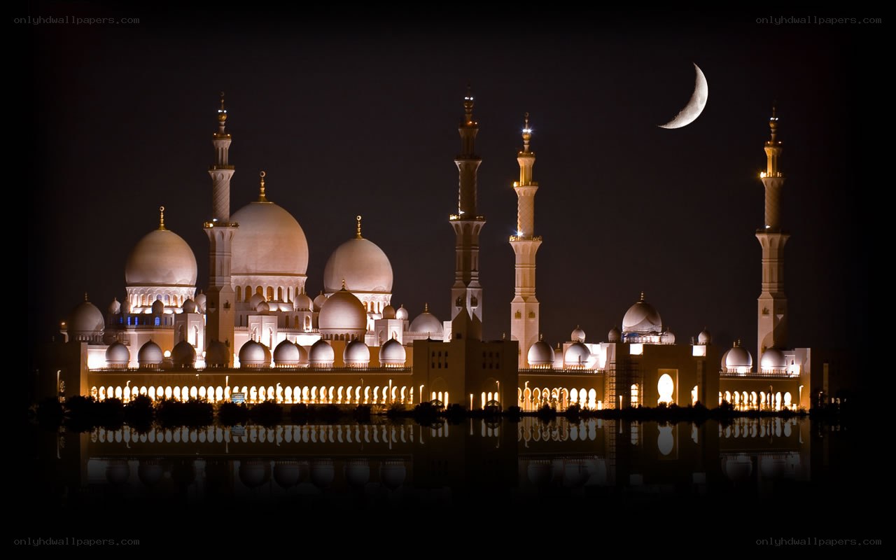 Grand Mosque at night with crescent moon