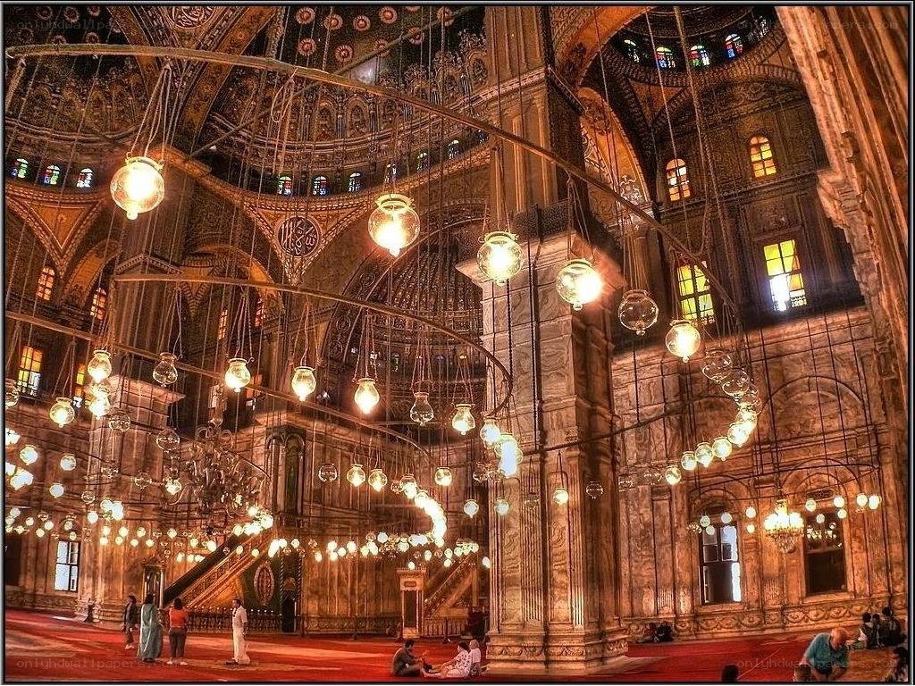 Grand mosque interior with chandeliers