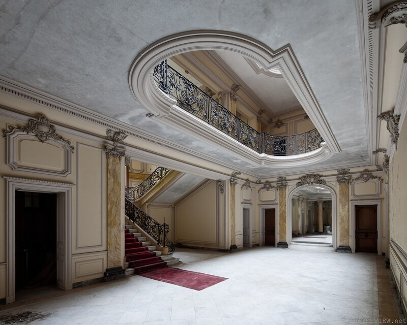 Grand staircase in an abandoned mansion