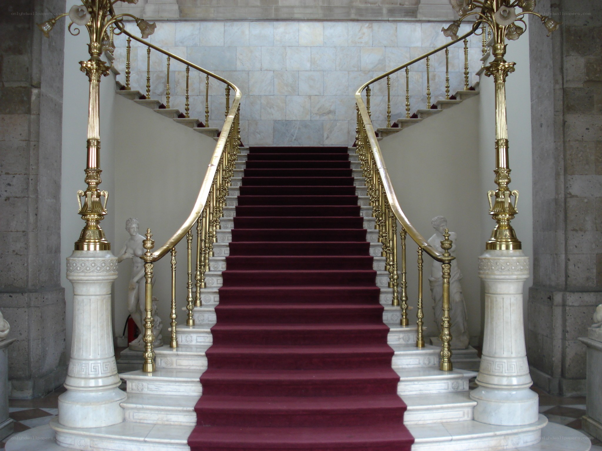 grand staircase with red carpet