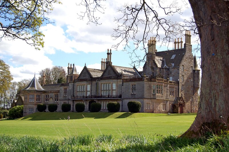 grand stone mansion in parkland