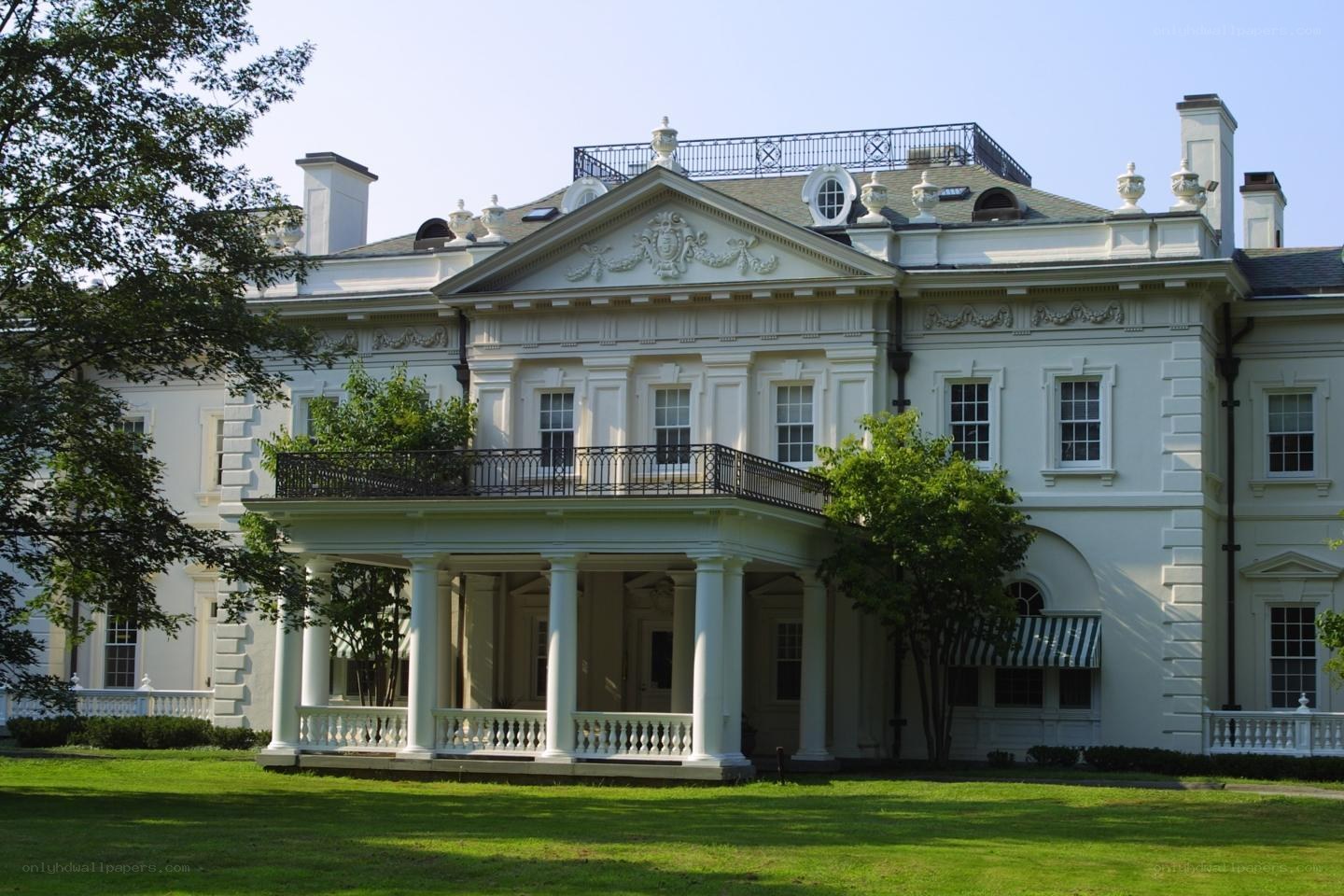 grand white mansion with columns