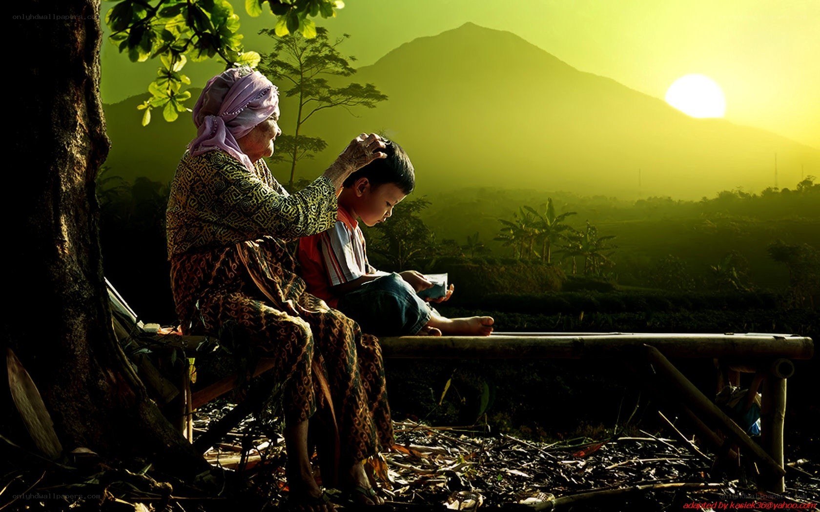 Grandmother and child at sunset