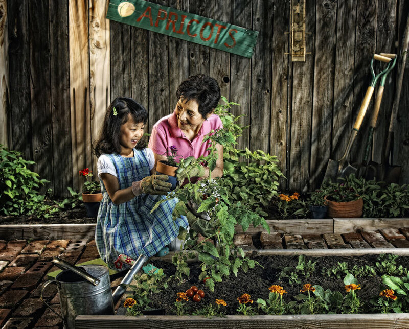Grandmother and granddaughter gardening