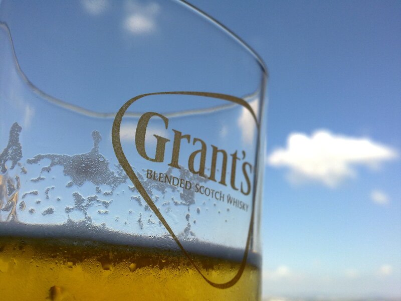 Grant's whisky glass against sky