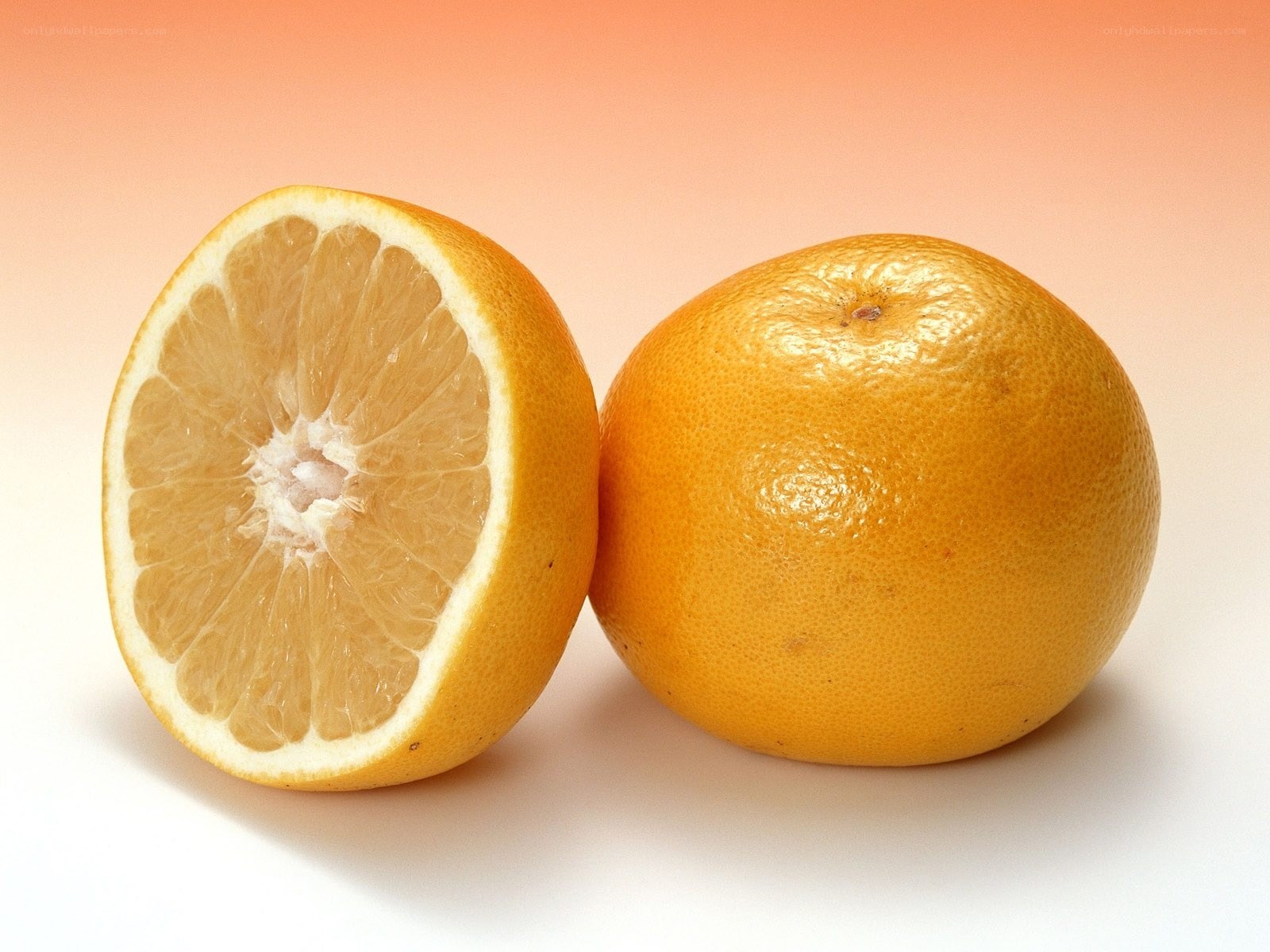 grapefruit halves on gradient