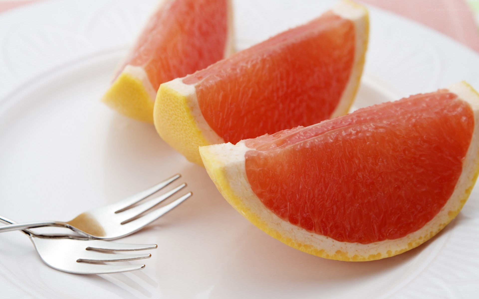 grapefruit slices on a plate