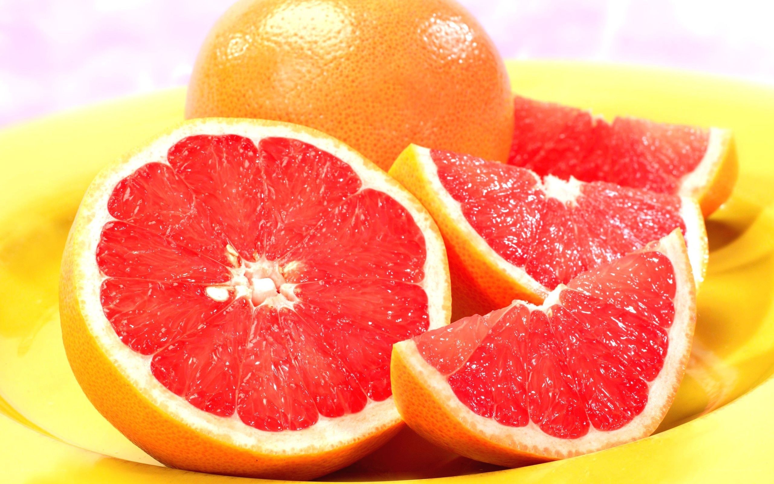 grapefruit slices on yellow plate