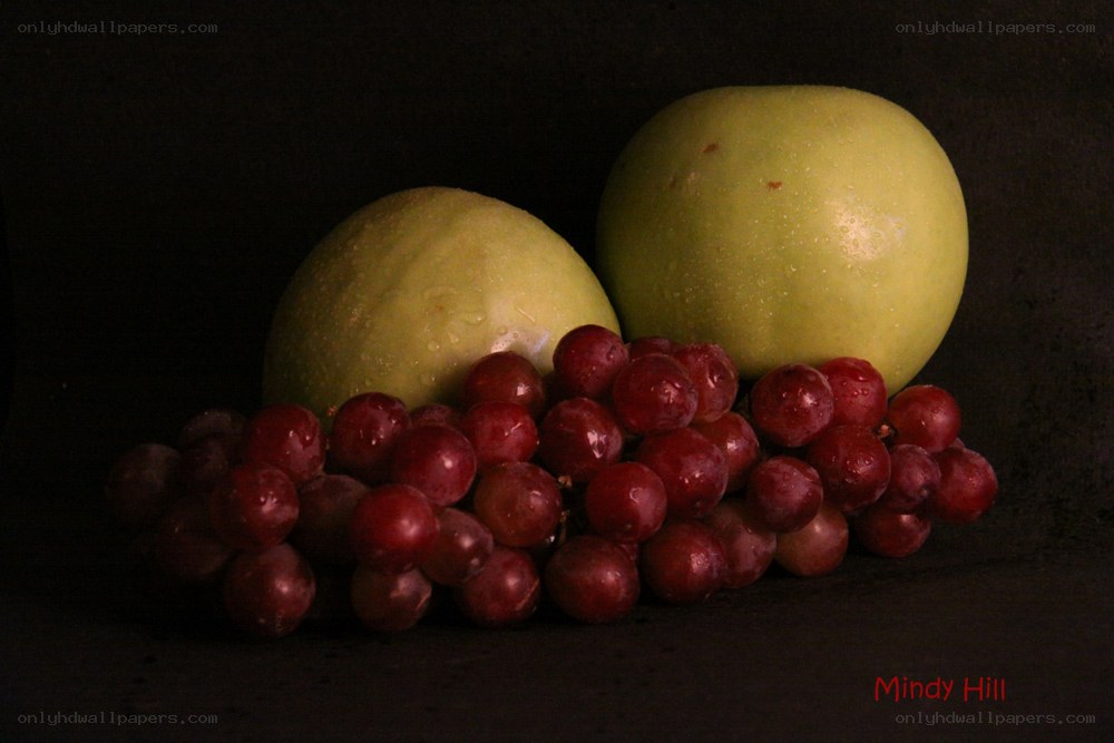 grapes and apples on dark background