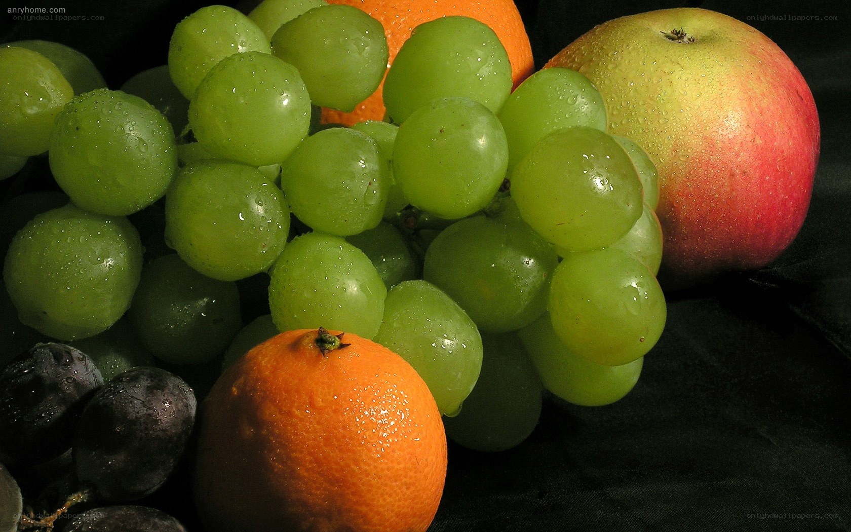 grapes and fruit on black