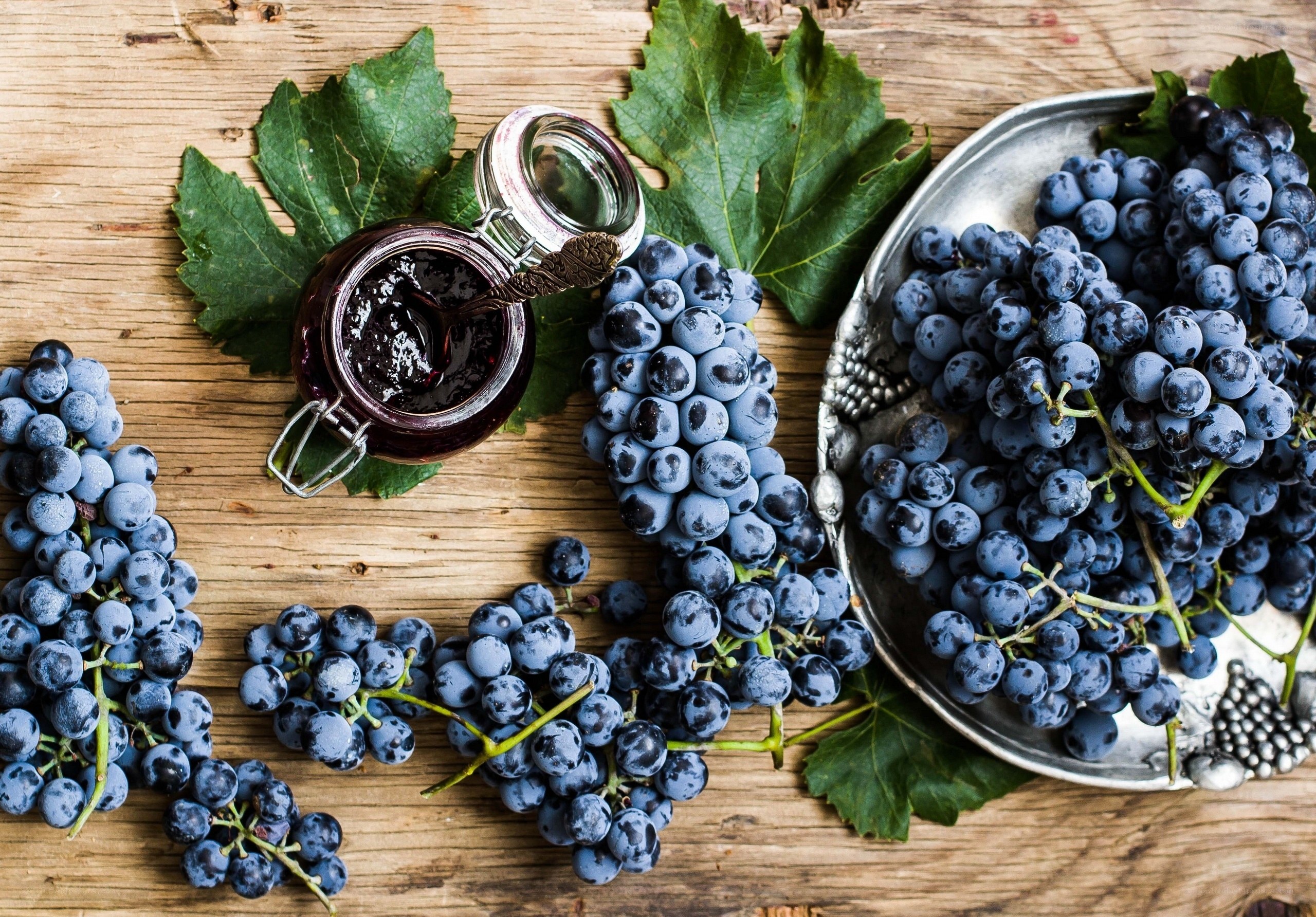 grapes and jam on wood