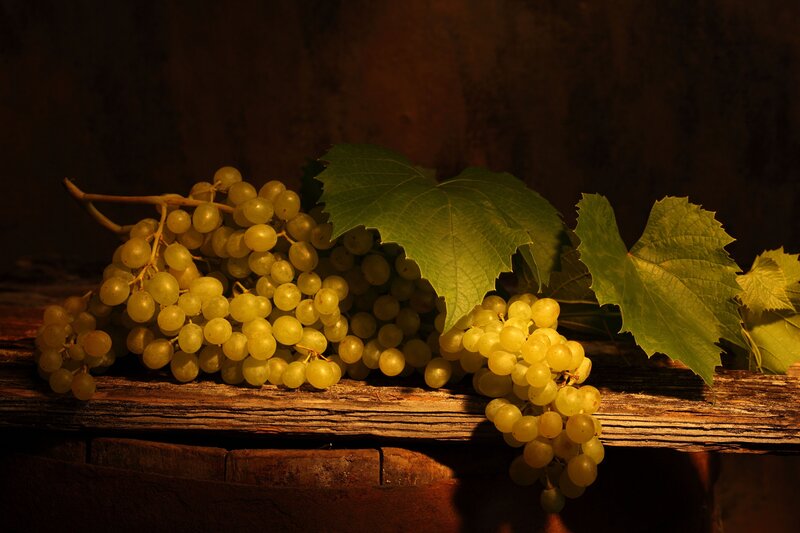 grapes and leaves on wood