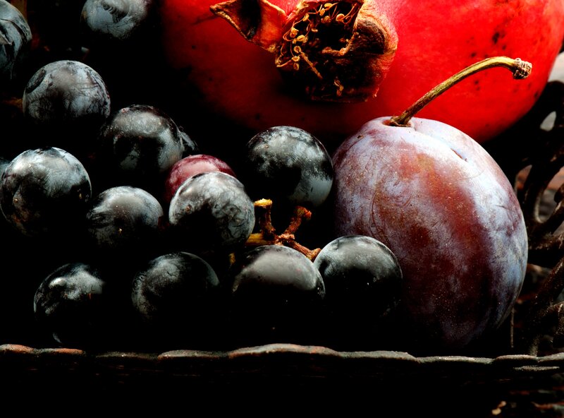 Grapes and Plums in Basket