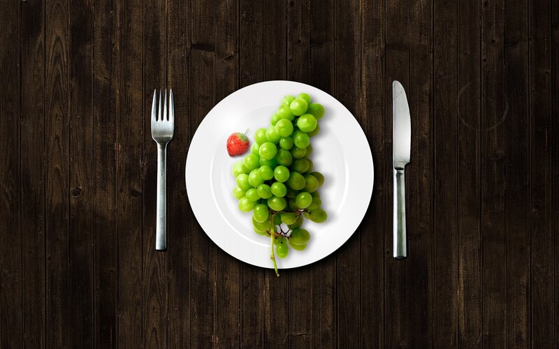 grapes and strawberry on plate