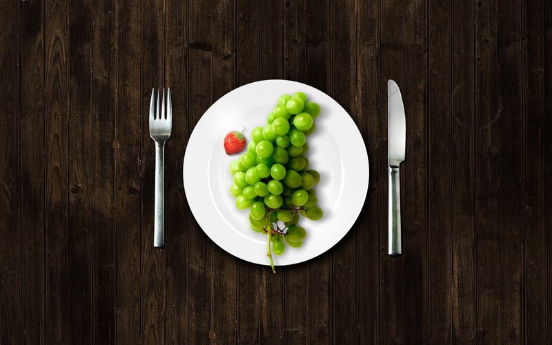 grapes and strawberry on plate