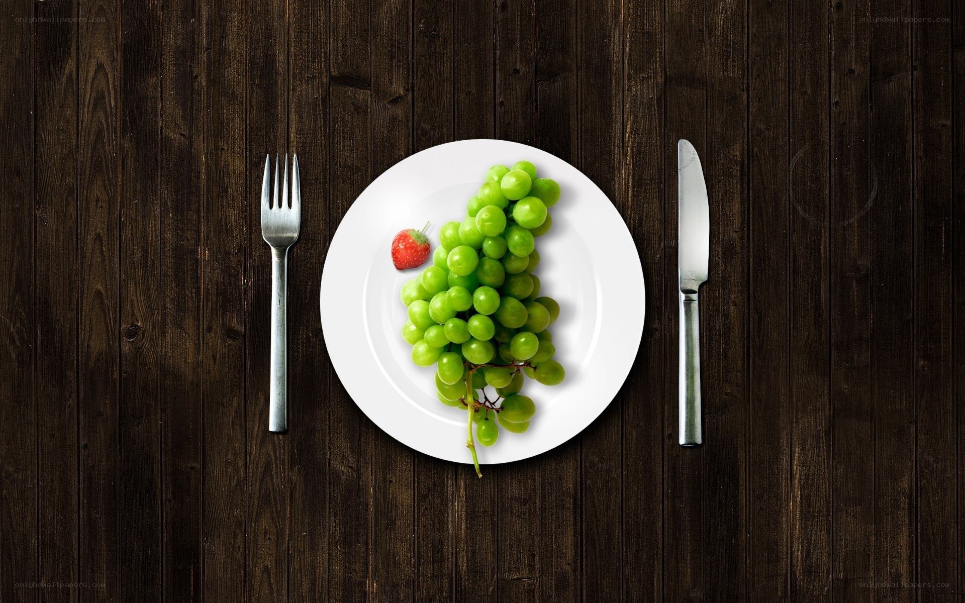 grapes and strawberry on plate