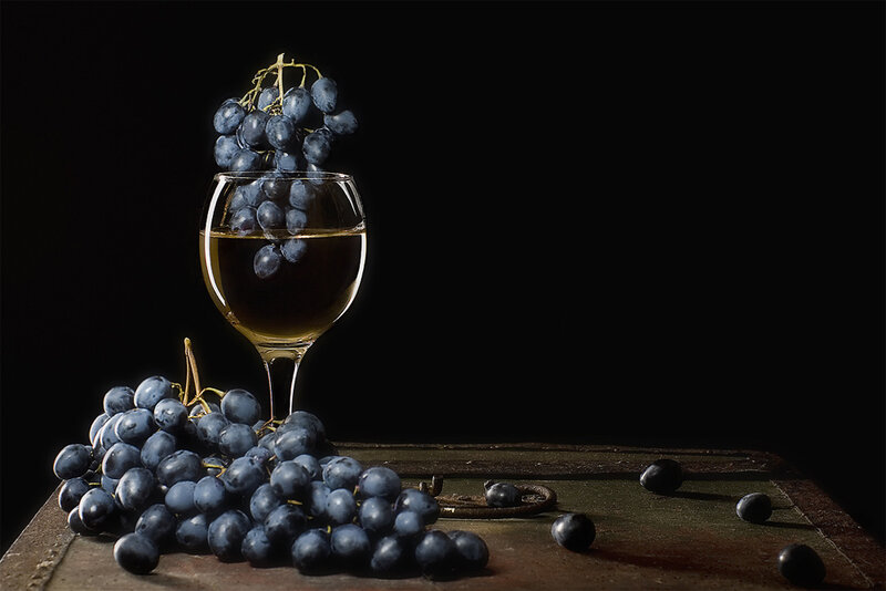 Grapes in Wine Glass