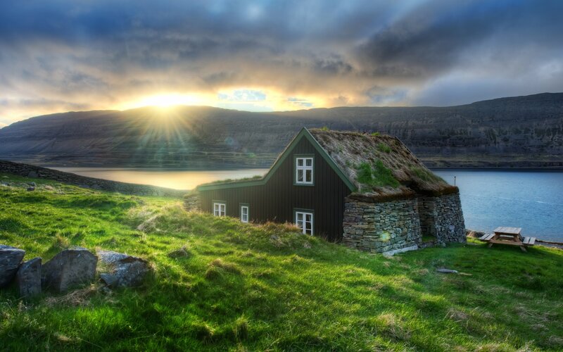 Grass-roofed House by Water