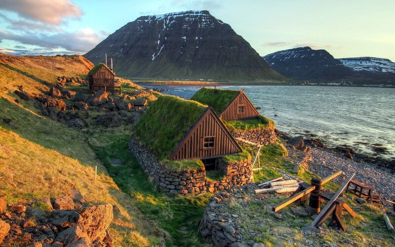 Grass-roofed Houses — Green, Serene, Sunset
