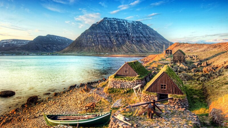 Grass-roofed Huts by Sea