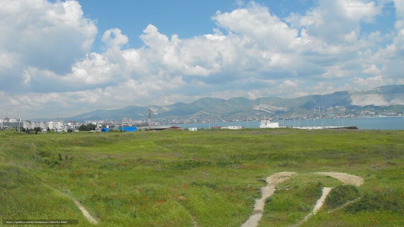 Grassland view of coastal city