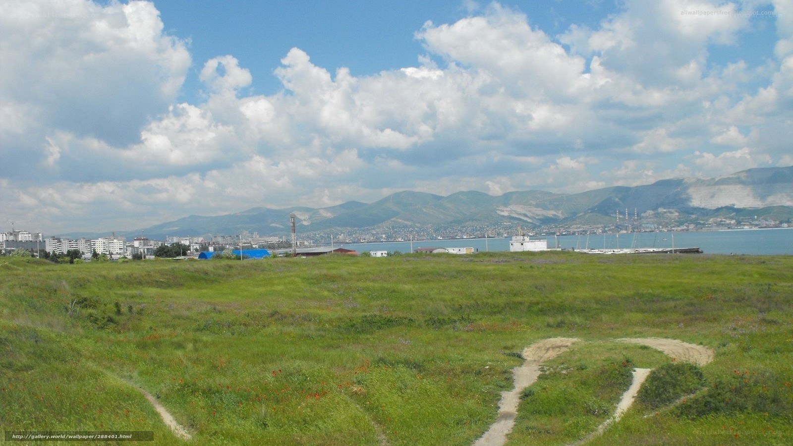 Grassland view of coastal city