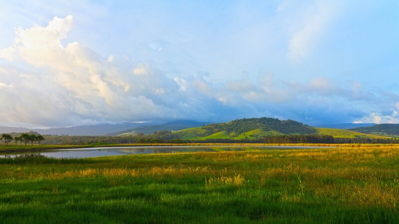 Grassland with lake and hills