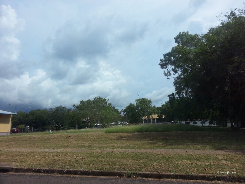 Grassy Field under Cloudy Sky — Green