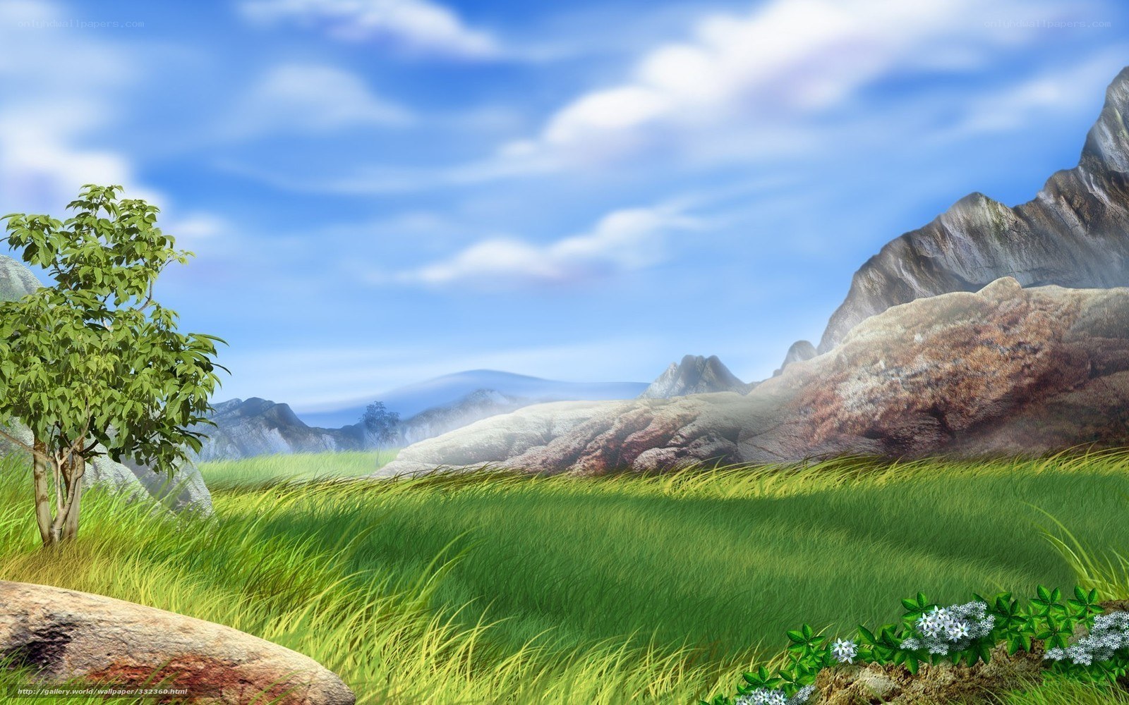 Grassy field with mountains