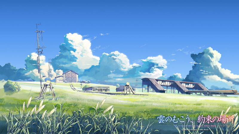 Grassy field with train station