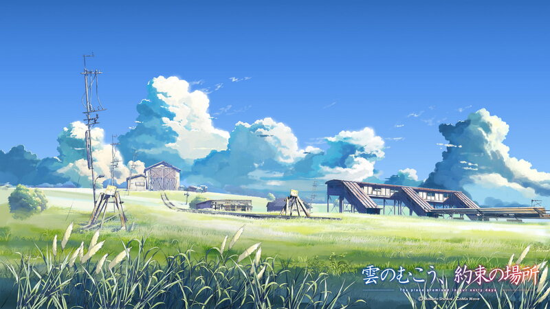 Grassy field with train station