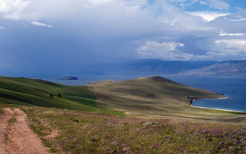 Grassy hills overlooking a lake