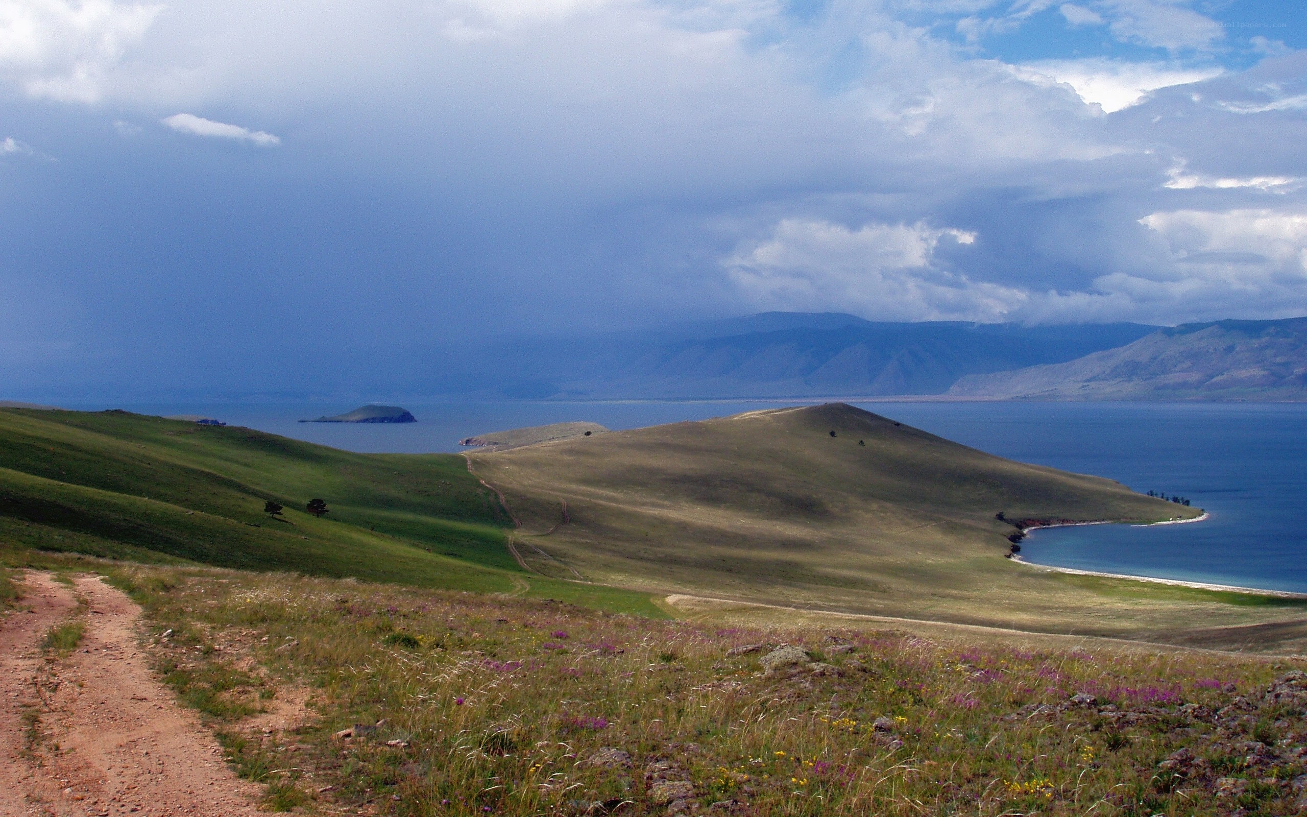 Grassy hills overlooking a lake
