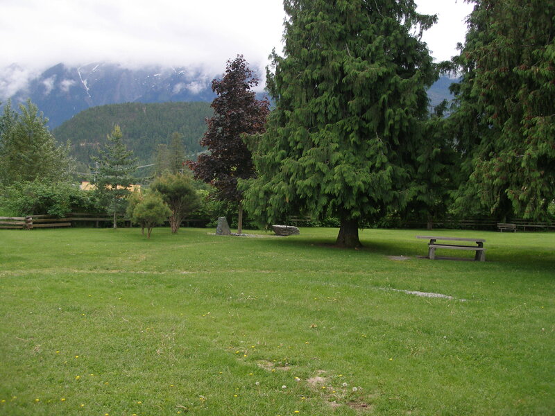 Grassy park with mountains