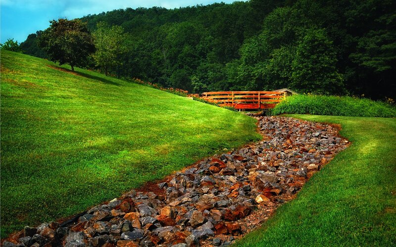 Gravel path through green landscape