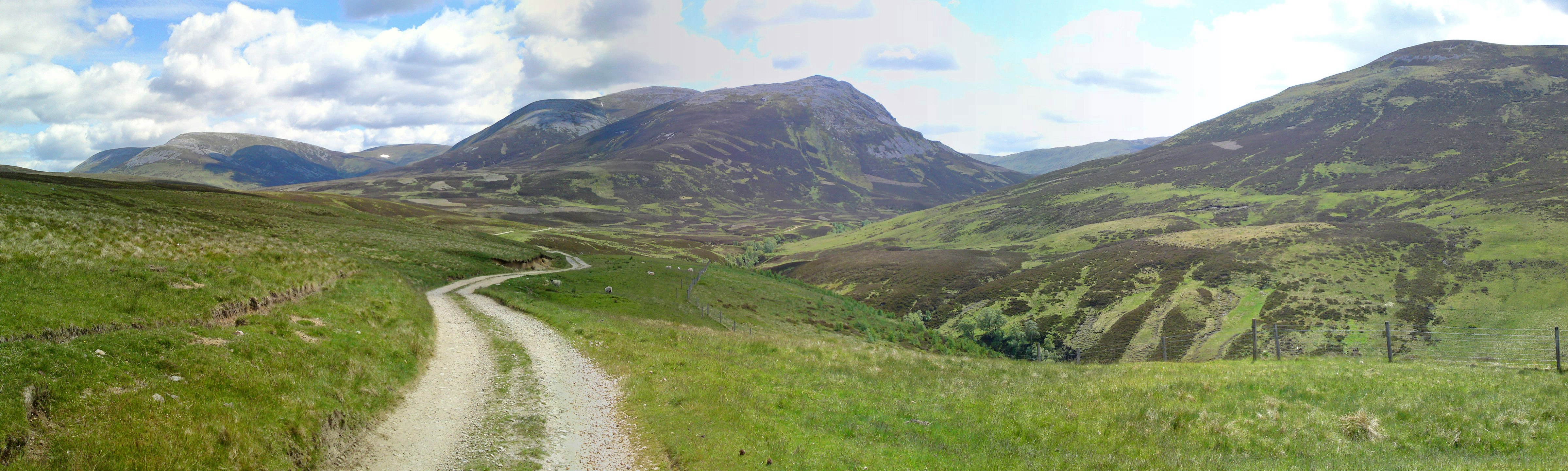 Gravel path through mountain valley