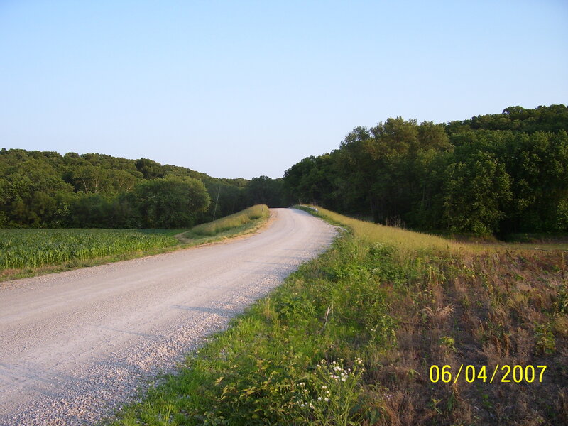 Gravel road through farmland